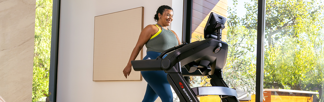 Woman walking on a treadmill