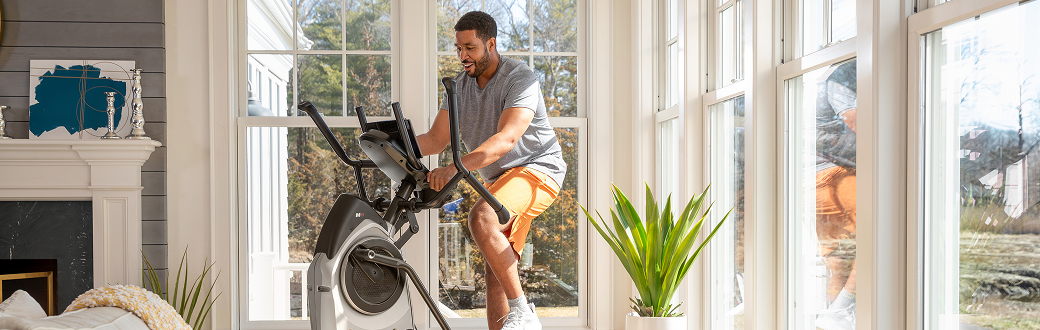 man working out on a maxtrainer m6